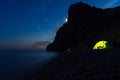 Tent on the beach at night. Full moon over the mountain Royalty Free Stock Photo