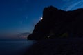 Tent on the beach at night. Full moon over the mountain Royalty Free Stock Photo