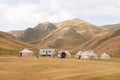 Tent camp with homes of the local nomadic asian people in a beautiful mountain valley