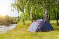 Tent in the camp near the river .