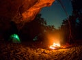 Tent camping car couple romantic sitting by bonfire night countryside