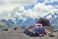 Tent climbers in the mountains. Against the backdrop of mountain peaks. alpinists camp Royalty Free Stock Photo