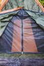 Tent in the forest close-up. Zipper. Picnic outside