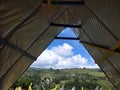 Tent on the hill in the countryside with clear blue sky and white clouds. of Indonesia Royalty Free Stock Photo