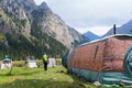 A backpacker tourist exploring a mountain camp
