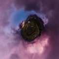 Tent in the mountains against the backdrop of purple clouds at sunset. Tiny planet 360vr panorama Royalty Free Stock Photo