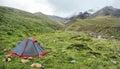 Tent in the mountains at sunrise