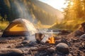 Tent near the river in summer with a fire and a pot from which steam comes from food