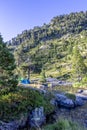 Tent next to glacial river in mountain landscape near refuge Wallon Marcadau in French Pyrenees, France, Europe Royalty Free Stock Photo