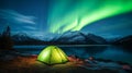 Tent Pitched Up on Shore of Lake Under Northern Lights Royalty Free Stock Photo
