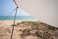 Tent poles and sunshades during the day at the seashore, pitch a tent on vacation