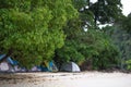 tent set on sand beach for staying overnight and with tree cover Royalty Free Stock Photo