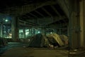 Tent set up outdoors under the bridge, simple tent of houseless person, homeless tent camp on a city street Royalty Free Stock Photo