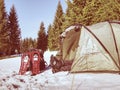 Tent, snow shoes, trekking poles and backpack ready for trip.