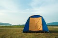 A tent spread on the lawn In the midst of nature for travel tourists Come to rest on the weekend Royalty Free Stock Photo