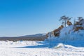 Tent tourist camp on the ice of a frozen lake. Active winter tourism, ice fishing. Russia, Lake Baikal, Olkhon Island. Snow season Royalty Free Stock Photo