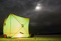 Winter fishing tent at night. Royalty Free Stock Photo