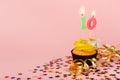 Tenth birthday cupcake with candle and sprinkles Royalty Free Stock Photo