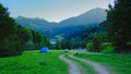 Tents and cars of campers sin the Romanian mountains in the morning