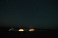 Tents from a camp behind the Erg Chebbi desert dunes in Merzouga, Morocco under a starry sky Royalty Free Stock Photo