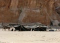 tents of a camp of a nomadic tribe near the Rocks in the desert