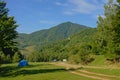 Tents and cars of campers in the Transylvanian mountains in the morning