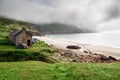 Tents by Keem beach, Achill island, county Mayo, Ireland. Low cloudy sky over mountain, morning scene. Irish landscape and nature Royalty Free Stock Photo