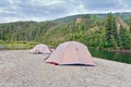 Tents at river in remote Yukon taiga wilderness Royalty Free Stock Photo