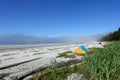 Tents set up for camping along a gorgeous seascape view of the sandy beaches of Cape Scott Provincial Park