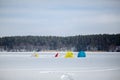 Tents on winter fishing on a frozen lake