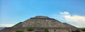 Teotihuacan pyramid on a blue sky day.