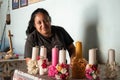 Smiling latin woman selling traditional candles. Teotitlan del Valle, Oaxaca, Mexico at a sunny day