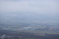 Teplice, Czech republic - December 15, 2018: industrial zone under Krusne hory mountains viewed from Doubravka castleduring