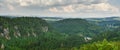 Teplicke Skaly mountain landscape, view of the mountain valley from the viewpoint on the rock. A cloudy summer day Royalty Free Stock Photo