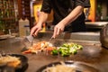 Teppanyaki Chef Cooking and Cutting Up Vegetables Royalty Free Stock Photo
