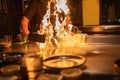 Teppanyaki Chef Cooking With Flames Royalty Free Stock Photo