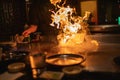 Teppanyaki Chef Cooking With Flames