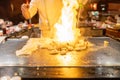Teppanyaki Chef Cooking Japanese Seafood Shrimp With Fire