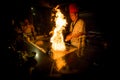 May, 2018 - Ari Atoll, Maldives: Happy teppanyaki chef cooking vegetables at teppan in a Japanese steakhouse on Mishi Sushi