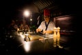 May, 2018 - Ari Atoll, Maldives: Happy teppanyaki chef cooking vegetables at teppan in a Japanese steakhouse on Mishi Sushi