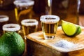 Tequila shot with lemon and sea salt on wooden background, selected focus Royalty Free Stock Photo