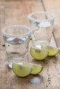 Tequila shots with lime on the table, selective focus