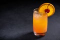 Tequila sunrise cocktail on dark stone background. With copy space. Royalty Free Stock Photo