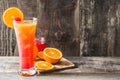 Tequila sunrise cocktail in glass on wooden table. Royalty Free Stock Photo