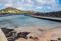 Terceira, Azores PORTUGAL - 4 August 2020 - Selective focus on rocks, sand and water from sea pools in Porto Martins beach