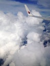 TERENGGANU, MALAYSIA - DECEMBER 30, 2015 : Soft focus of Malaysian Airline System (MAS) aeroplane wing over cloud and blue sky