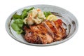 Teriyaki chicken served with potato salad, sliced lemon, totmato and green oak in round stone plate Royalty Free Stock Photo