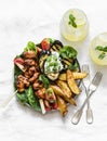 Teriyaki chicken skewers, roasted potatoes, vegetables, grilled eggplant and lemon mint cocktail - delicious appetizer plate, Royalty Free Stock Photo