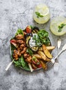 Teriyaki chicken skewers, roasted potatoes, vegetables, grilled eggplant and lemon mint cocktail - delicious appetizer plate, Royalty Free Stock Photo