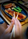 Teriyaki salmon pan fried on the wooden.